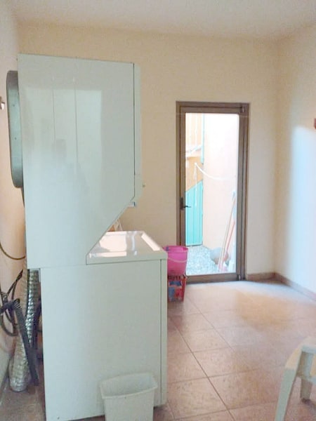 Basement laundry room served by a laundry lift, with the water filters, in this Mexico investment property