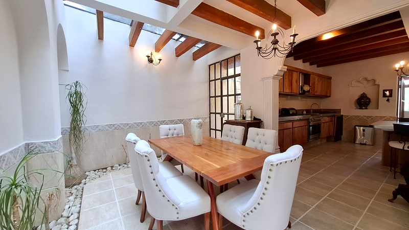Breakfast room with skylight seating six — luxury home in Oaxaca, Mexico