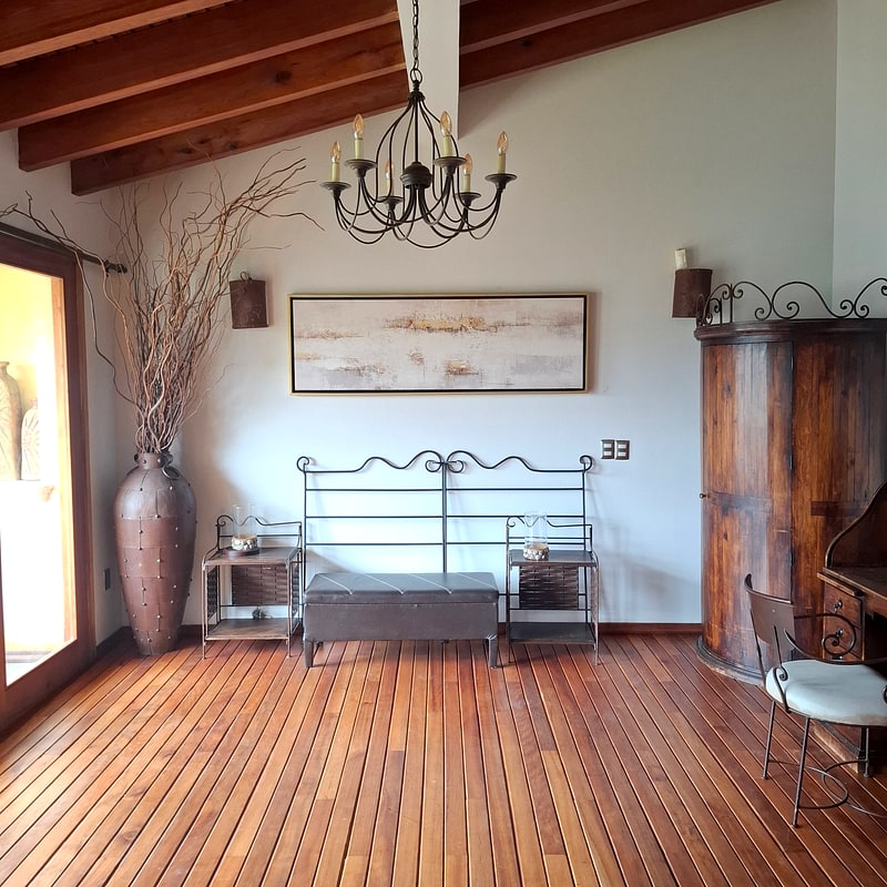Bedroom 2 suite with hardwood floors and antique armoire — luxury residence in San Felipe del Agua, Oaxaca