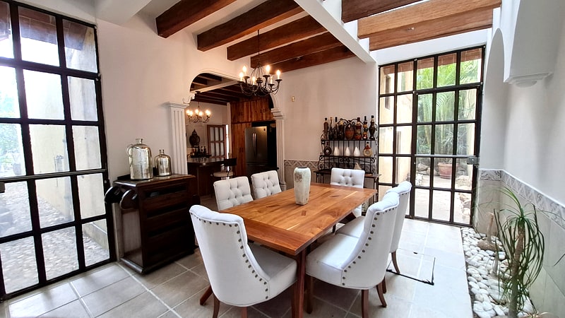 Breakfast room with bar and steel-framed garden windows — Oaxaca real estate for sale