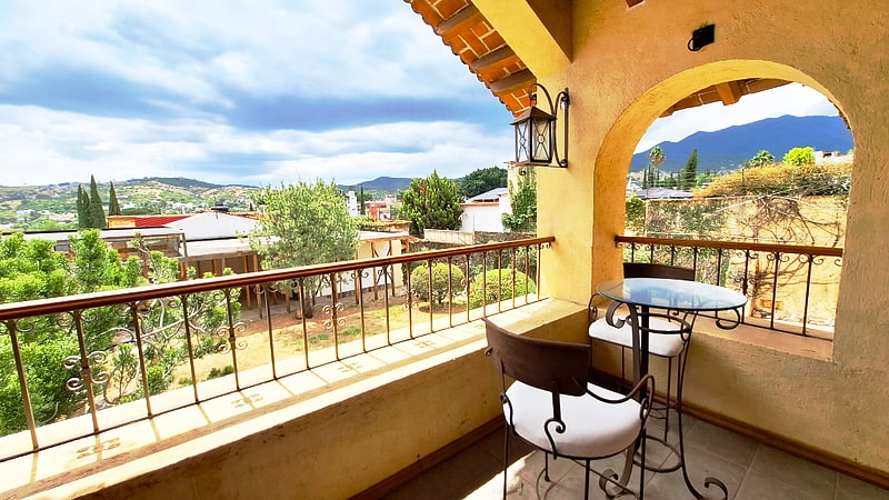 Second floor terrace reached through floor-to-ceiling glass — Mediterranean house in San Felipe del Agua