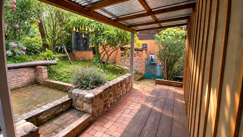Back yard and patio on the sloped lot behind the main house, 1,000 square meter mountain property for sale near San José del Pacífico