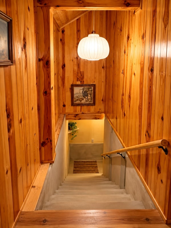 Wooden stairway joining the two floors of the main house, turnkey mountain home for sale in San Mateo Río Hondo, Oaxaca