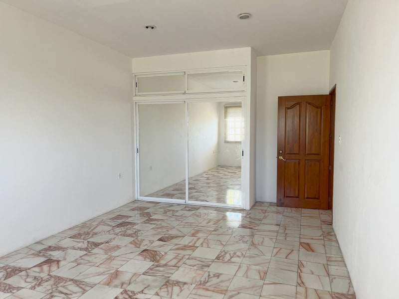 Basement bedroom floored in rose marble in a luxury house for rent in Colonia Estrella, Oaxaca